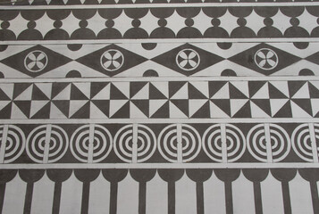 Carved geometric shapes on a wall in the Pyrgi village at South Chios Island