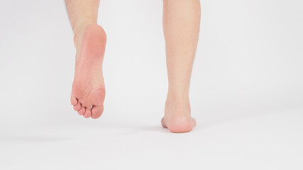 Asian Male legs and barefoot is isolated on white background