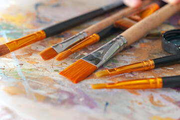 Obraz premium Brushes on the artist's canvas are covered with paints