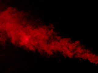 The texture of red smoke on a black background. Close-up