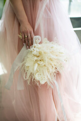White bridal bouquet of dried flowers, atmospheric photography minimalism