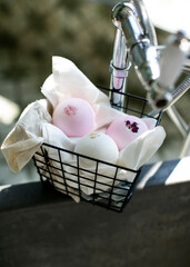 
Bath bombs pink and white in a basket on the bathroom