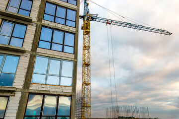 Aerial view of high residential apartment building under construction. Real estate development.