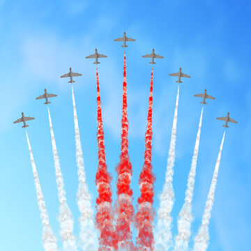 Vector illustration with planes and trails in white, and red colors isolated on sky background. 