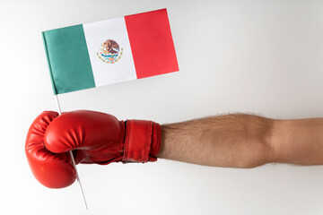 Boxing glove with Mexican flag. Boxer holds flag of Mexico. White background.