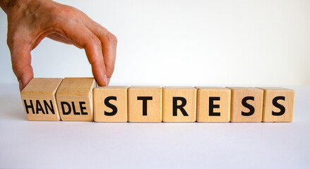 Handle stress symbol. Businessman turns cubes and changes words 'stress' to 'handle stress'. Beautiful white background. Medical, psychological, handle stress concept. Copy space.