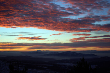 view of foggy mountains at sunset