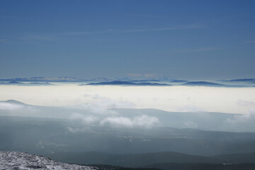 Obraz na płótnie Canvas view of snowy mountains in fog
