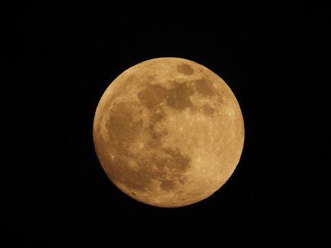 Full moon against the black sky