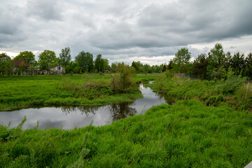 Fototapeta na wymiar River near the walking trail in park
