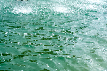 green water spatter and bubbles