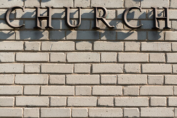 brick wall with 3d letters CHURCH