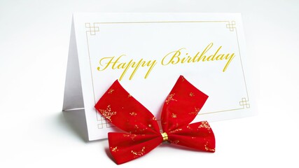 Happy birthday text on greeteng card with bow