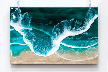 Wall panel with a tide on the seashore made of epoxy resin.