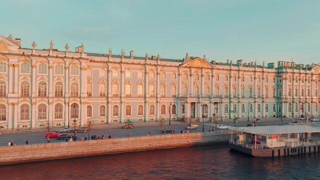 Aerial view of Incredibly beautiful Dvortsovaya Embankment in the center of St. Petersburg on the sunset, the well-known museum Hermitage, St. Isaac's Cathedral on a background, the Admiralty building