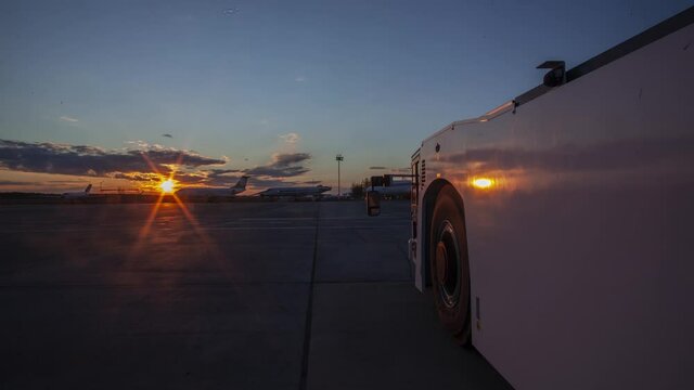 aircraft tractor in the setting sun
