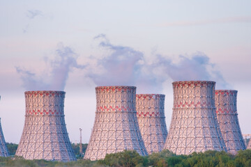 Cooling towers of Nuclear power plant emissions of steam in the air atmosphere. Industrial zone...