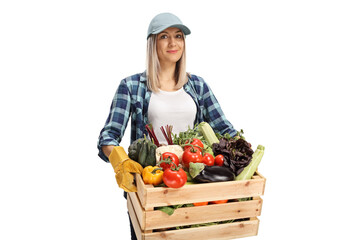 Young woman with a crate full of vegetables