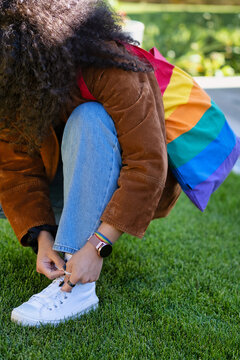 Lgtb Girl Ties The Laces Of Her Sneakers