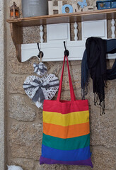 image of lgtb bag hanging on a coat rack in a warm home