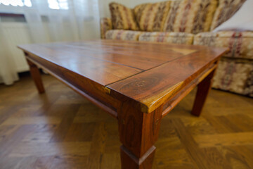 wooden lacquered table in the interior