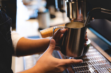 professional barista making espresso coffee to a drink cup in cafe, beverage caffeine machine, person pouring hot water with hand, business in the morning breakfast, fresh aroma in hot drink