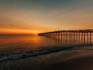 Fototapeta na wymiar Nags Head Pier at sunrise, in the Outer Banks, North Carolina