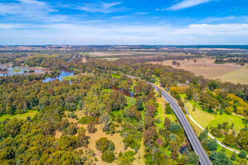 Fototapeta na wymiar Aerial view of Thomson River and rural highway near Sale, Victoria, Australia