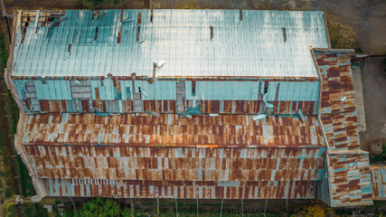 Rusty zinc roof of abandoned barn. Overhead view.