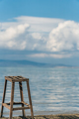 wooden chair on the beach