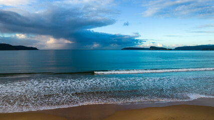 Rain Clouds and Sunrise at the Beach