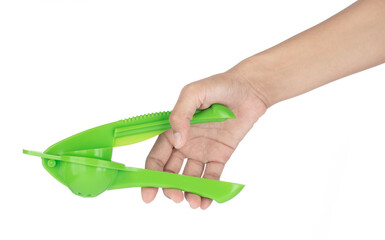 Hand holding Manual green lemon squeezer isolated on white background.