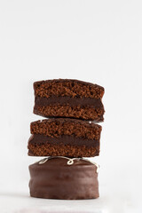 A pile of honey cookies with chocolate on white background.