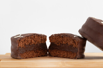 Close up of honey cookie stuffed with chocolate on white background.