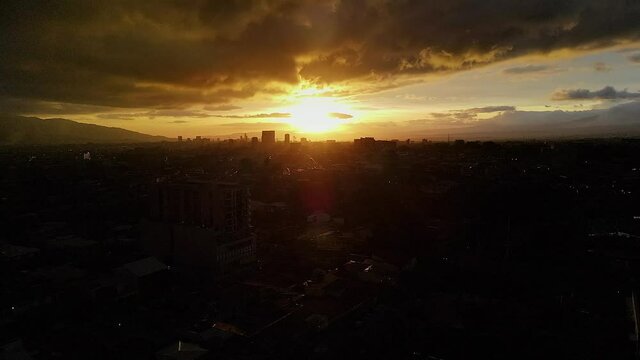 Beautiful cinematic aerial view of a sunset of the city of San Jose Costa Rica 