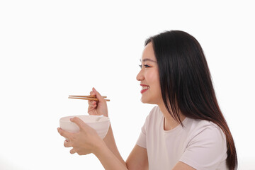 Beautiful young south east Asian woman holding chinese empty chopstick soup spoon bowl utensil pretend acting posing see eat taste feed offer satisfaction yummy white background happy