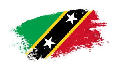 Flag of Saint Kitts and Nevis country on brush paint stroke trail view. Elegant texture of national country flag