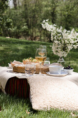 Al fresco dinning in backyard with pasta and drinks in lush green surrounding