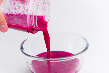 Healthy dragon fruit juice. Freshly squeezed dragon fruit juice, portable juicer and dragon fruit