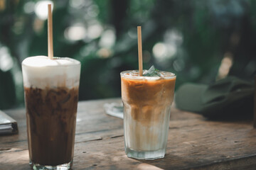 Selective focuson iced latte coffee and iced mocha on wooden table