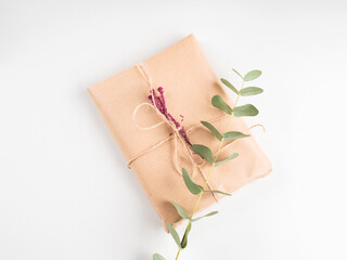 Wrapped gift boxes in craft paper with dried flowers decor