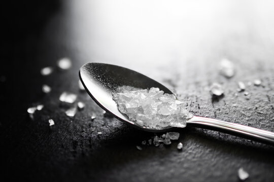 Amphetamine in spoon on black background. Narcotic Recreational drug speed. Substance abuse concept.copy space.