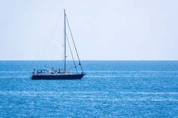 Obraz premium Sailing yacht in the blue calm sea.