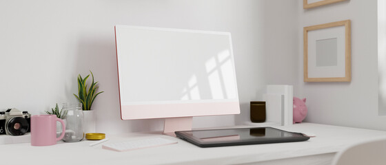Pink pastel computer monitor with mock-up screen, drawing tablet and supplies on the table, 3D rendering