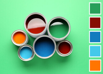 Cans of paints on green background. Different color patterns