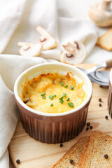 Ramekin with tasty julienne on table