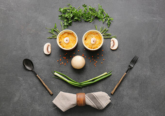 Creative composition with tasty julienne and ingredients on dark background