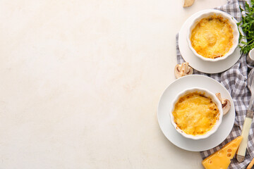 Ramekins with tasty julienne on light background