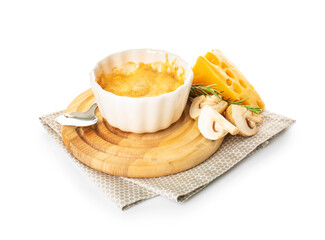Ramekin with tasty julienne and ingredients on white background