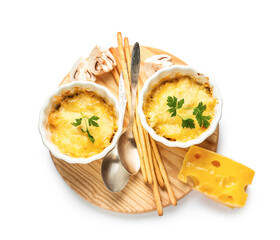 Ramekins with tasty julienne and ingredients on white background